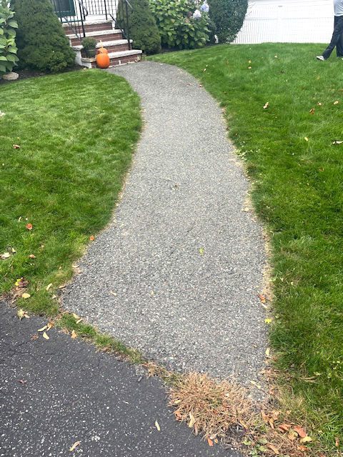 After photo of beautiful new stone walkway leading up to house
